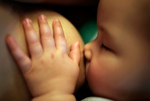 getty rm photo of baby with hand on breast