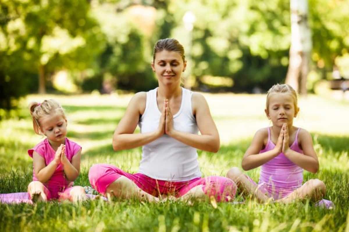 depositphotos 121394778 stock photo yoga in the park