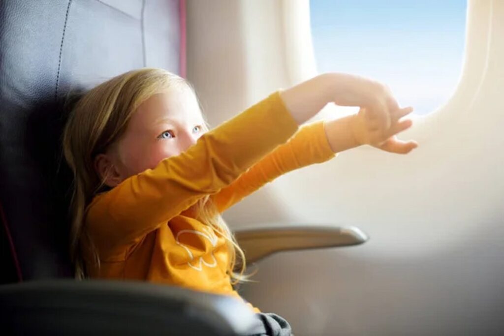 depositphotos 145515399 stock photo child sitting by aircraft window